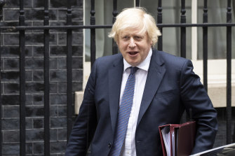 British Prime Minister Boris Johnson leaves 10 Downing Street to attend the weekly Prime Minister's Questions on Wednesday.