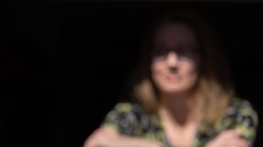 "Jay" at home with her children, escaped serious domestic violence by her partner, a police officer.