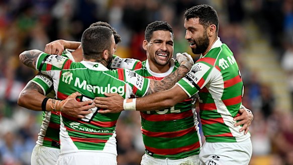 Cody Walker is congratulated by teammates after scoring at Suncorp Stadium.
