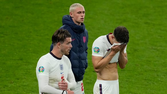 Disappointed England players leave the pitch after the draw with Scotland.