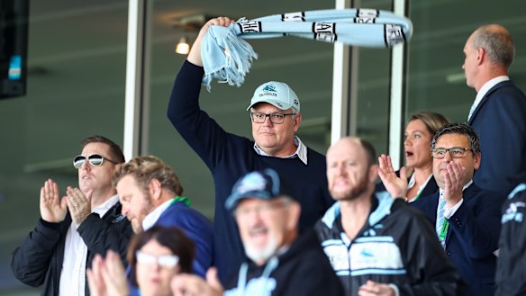 Scott Morrison cheers on the Sharks.