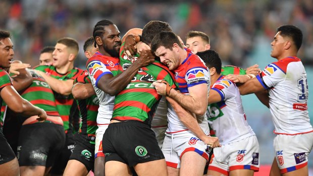 Fight night: South Sydney and Newcastle players get up close and personal before four players were sent to the sin bin.