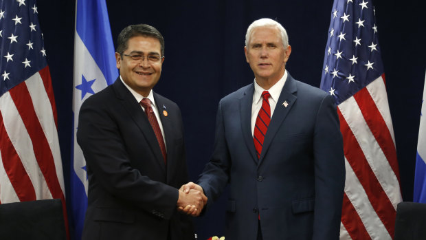 Honduras' President Juan Orlando Hernandez with US Vice-President Mike Pence in 2017.