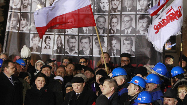 Jaroslaw Kaczynski, centre, speaks during the demonstration organised by Polish party Law and Justice on the 35th anniversary of the introduction of martial law at Three Crosses Square, in Warsaw, Poland, in 2016.