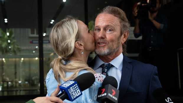 Craig McLachlan, pictured with his partner Vanessa Scammell, in December 2020.