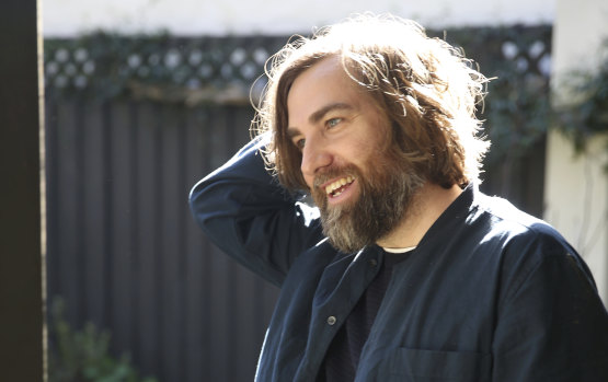 Josh Pyke pulls out "the classic" photo pose in the backyard of his home in Sydney's inner west.