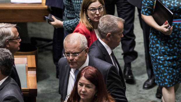 Prime Minister Scott Morrison leaves the House of Representatives after losing a vote.
