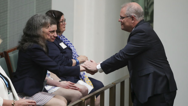 Prime Minister Scott Morrison with mother of abuse victims Chrissie Foster in Parliament on Monday.