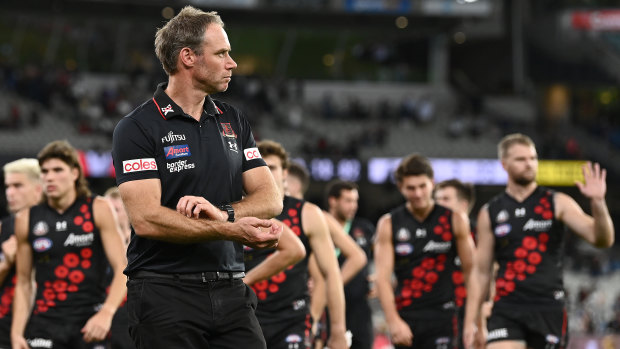 Ben Rutten and the Bombers leave the field after their loss to Collingwood.