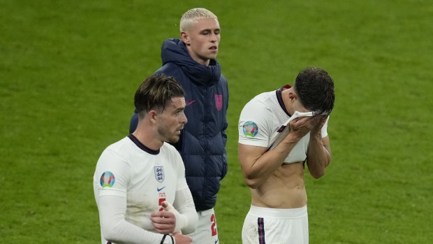 Disappointed England players leave the pitch after the draw with Scotland.