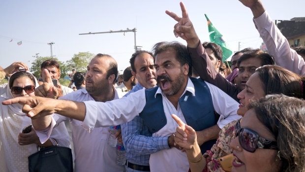 Supporters of former Pakistani prime minister Nawaz Sharif react outside the court following the ruling against him.