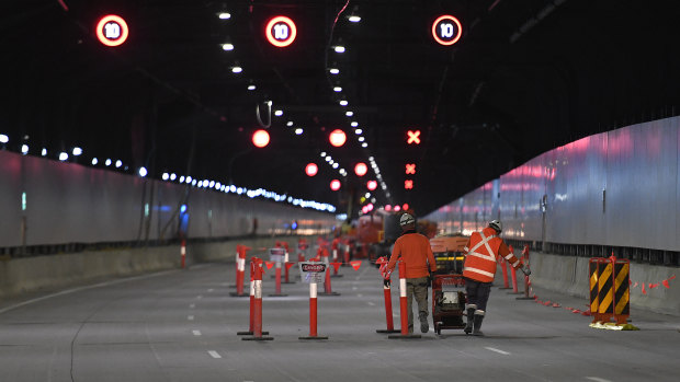 Construction workers in the almost-completed M4 East tunnels.