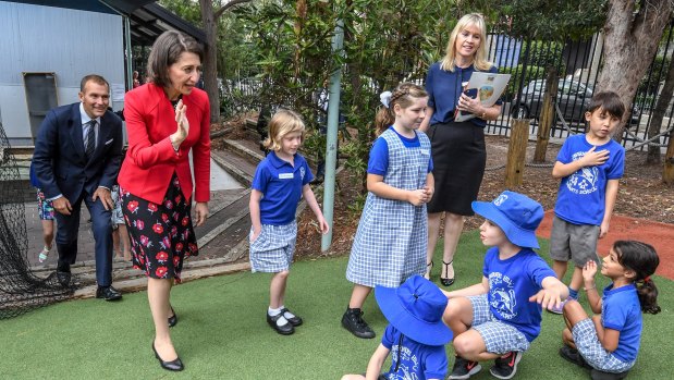 NSW Premier Gladys Berejiklian is seen with students from the Taverners Hill Infants School during a visit earlier this year.