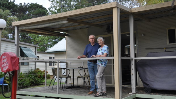 Canberra couple Elizabeth and Robin Turnbull outside their cabin, which they have been ordered to remove from Tomaga River Holiday Park by August 31.