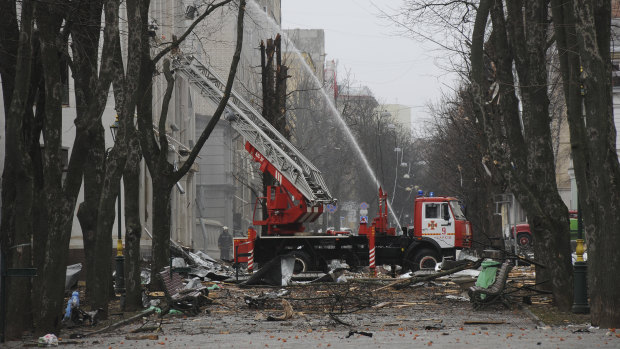 Firefighters extinguish a building after a rocket attack in Kharkiv.