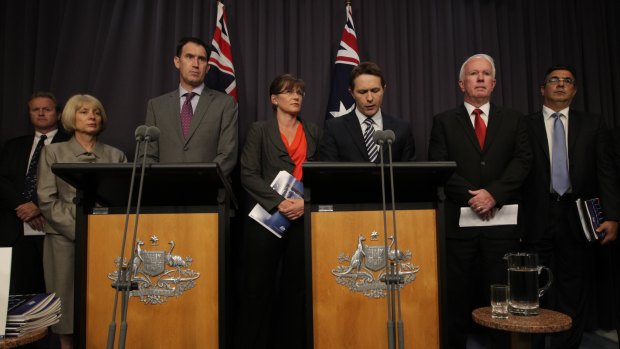 Home Affairs Minister Jason Clare and Sports Minister Kate Lundy with sporting code representatives at the infamous "blackest day" press conference in Canberra on February 7, 2013.