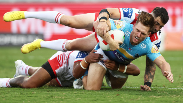 Alexander Brimson of the Titans is tackled during the round two NRL match against the St George Illawarra Dragons.
