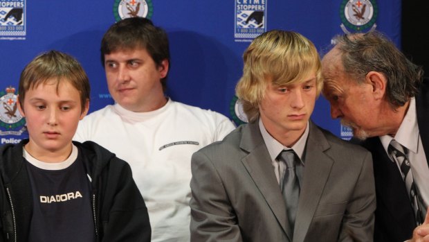 Belinda's family at a 2011 press conference to announce a $100,000 reward - her two sons, Billy Moffett and Cody Peisley, her former partner, William Moffett (back) and father Mark Wearne (right). 