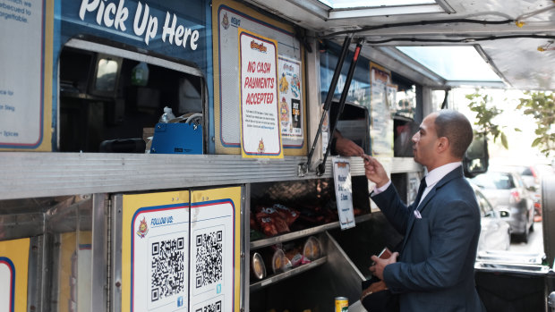 Vincent Morr orders lunch from a cashless food truck in San Francisco.