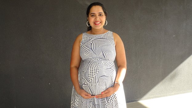 Ashwitha D'Souza standing outside her apartment building the day before she gave birth. 