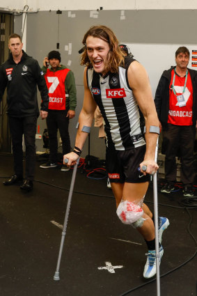Darcy Moore was on crutches after the win over the Gold Coast Suns but revealed on Monday he had escaped structural damage.