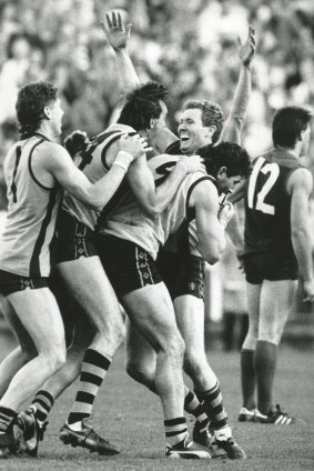 Gary Buckenara raises his arms in delight after kicking the winning goal after the siren against Melbourne.
