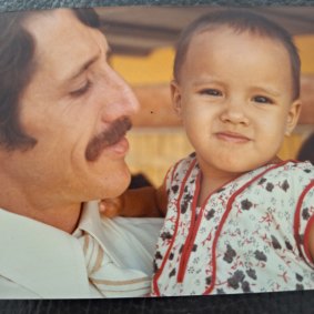 A childhood photograph of Zomi with her father.