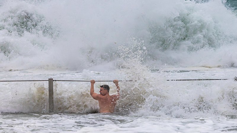 Flash floods and landslide in Sydney as wild weather hits