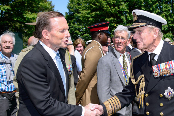Former PM Tony Abbott with Prince Philip in 2014; the following year, he granted the British royal a knighthood on Australia Day. 