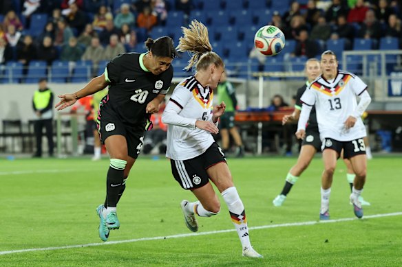Sam Kerr gets her head to the end of Carpenter’s cross.