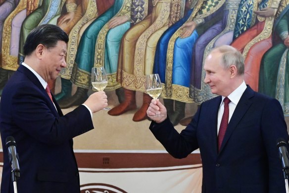 Russian President Vladimir Putin, right, and Chinese President Xi Jinping toast during their dinner at The Palace of the Facets is a building in the Kremlin.