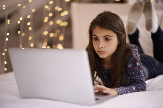 Student using laptop at home.