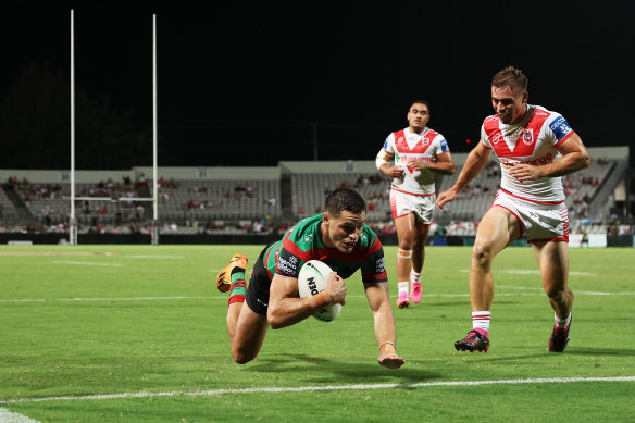 Braidon Burns scores a try during the NRL Pre-Season Challenge round one match against the Dragons. 