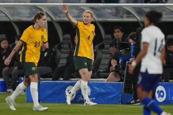 Matildas defender Clare Polkinghorne waves goodbye after her final game.