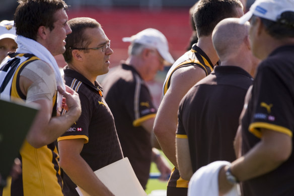 David Rath (centre) in his days as an assistant coach with Hawthorn.