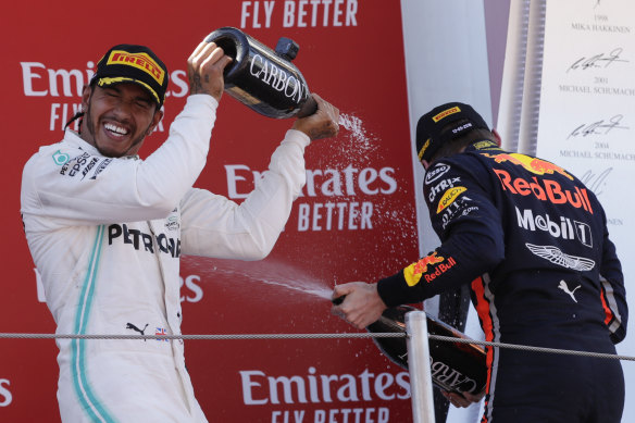 Lewis Hamilton, left, and Max Verstappen, right, on the podium at the 2019 Spanish Grand Prix. 
