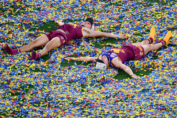 Hugh McCluggage and Dayne Zorko on the ground after the game.