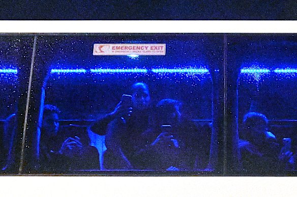 Iranian players film supporters blocking their departure following the side’s game against the Philippines at Gold Coast Stadium on Sunday.