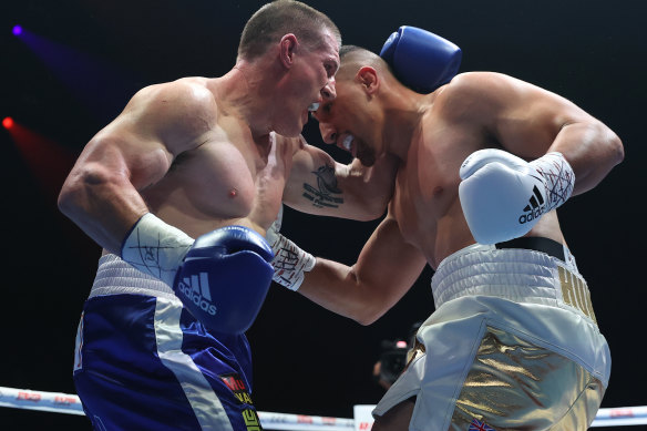Justis Huni punches Paul Gallen during their Australian heavyweight title fight between Justis Huni and Paul Gallen at ICC Sydney on June 16, 2021 in Sydney, Australia.