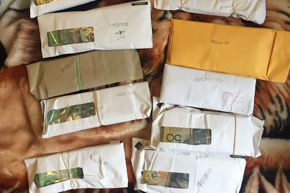A photo of the envelopes containing bundles of cash which Ibrahim Helmy sent to his friend Adam Taki in 2015.