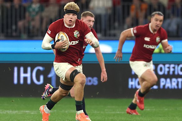 Henry Pollock of the British & Irish Lions breaks clear.