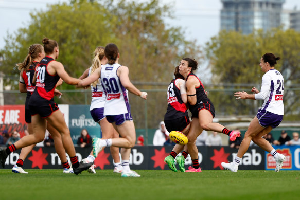Amber Clarke and Bonnie Toogood of the Essendon Bombers collide in opening round game at Windy Hill.