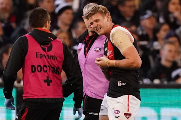 Essendon's Michael Hurley dislocated his shoulder.