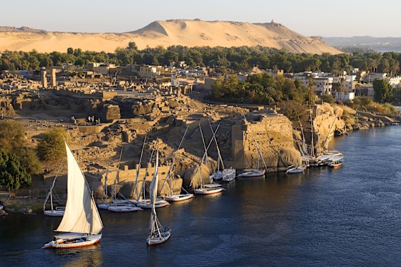 Feluccas moored at the ancient ruins of Swenet on Elephantine Island in Aswan.