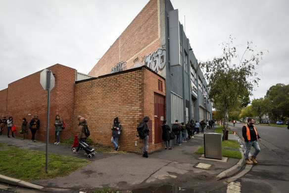 The queue for emergency food relief at a Southbank charity in Melbourne. The coronavirus outbreak has highlighted the nation's dependence on foreign students and casual workers.