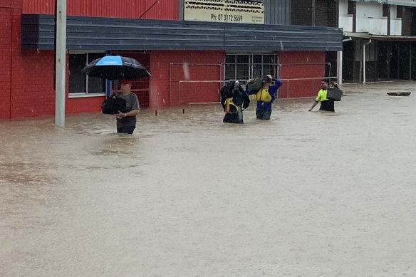 Business owners in Oxley have been trying to move stock to higher ground