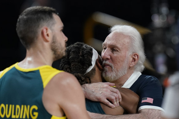 Gregg Popovich hugs Patty Mills post game.