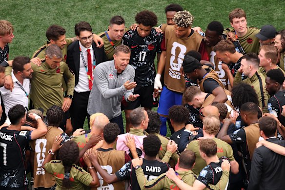 Canada coach Jesse Marsch speaks to his players after their famous win.