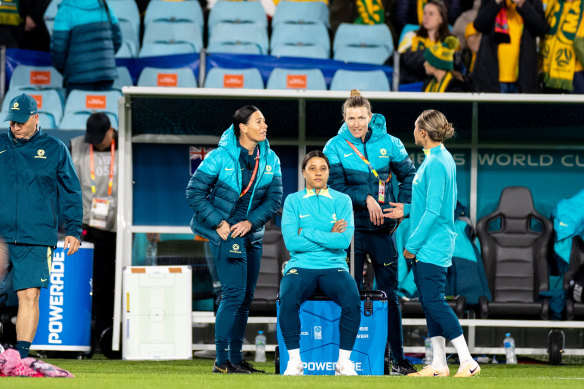 Sam Kerr sits on the sideline injured ahead of the Matildas clash with Ireland.