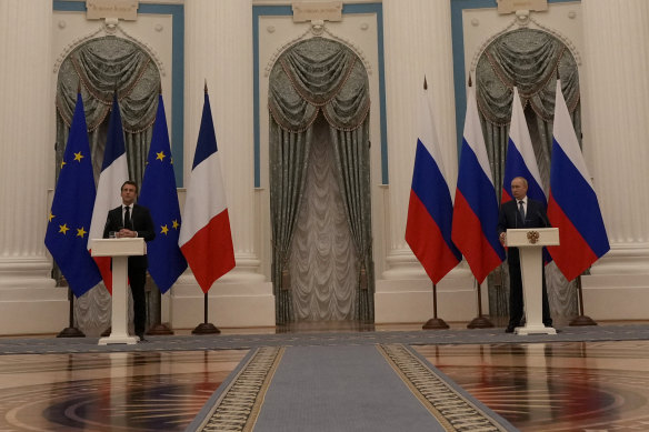 Russian President Vladimir Putin, right, and French President Emmanuel Macron, attend a join press conference in Moscow on Tuesday AEDT.